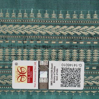 Close-up of green Sambalpuri silk fabric, showing its luxurious texture and fine handloom weave.