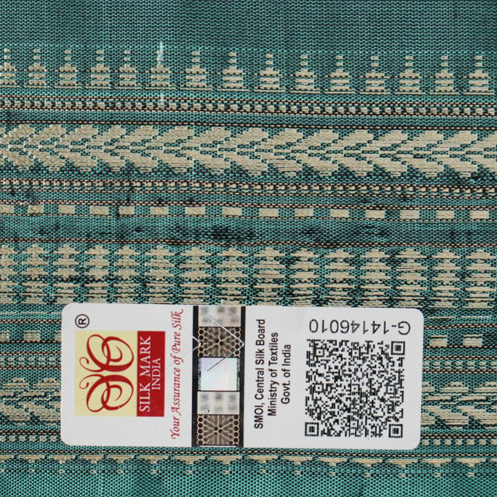 Close-up of green Sambalpuri silk fabric, showing its luxurious texture and fine handloom weave.