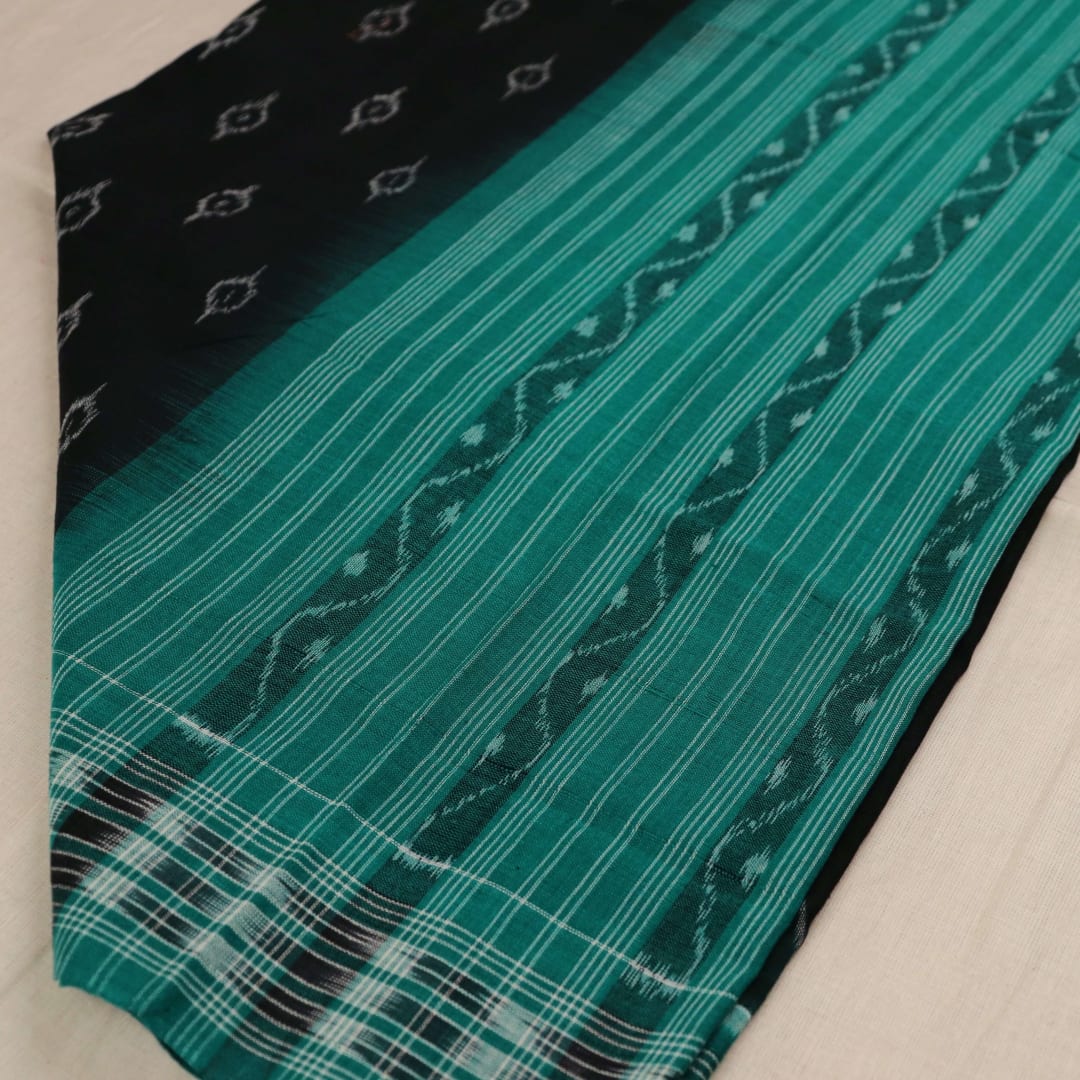 Styling view of a black and green Sambalpuri cotton dupatta with intricate motifs