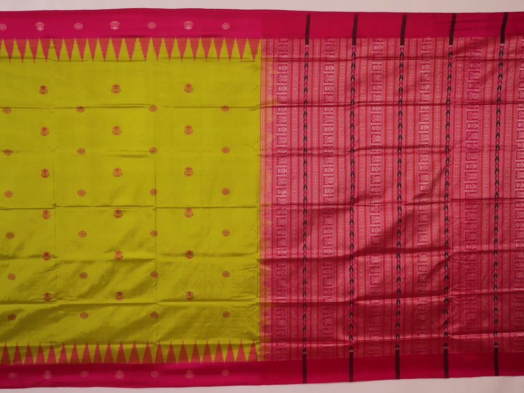 Close-up of green and magenta Bomkai silk saree fabric texture, highlighting intricate weave and butta pattern.