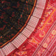 Close-up of Sambalpuri silk fabric texture, highlighting fine handloom weave in black and maroon.
