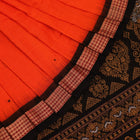 Full view of a Bomkai cotton saree in orange with black butta pattern