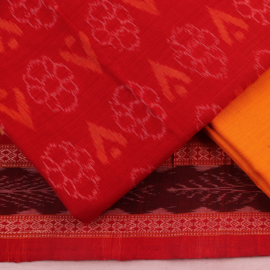 Detail of red and yellow Sambalpuri cotton dress material blouse piece, featuring motifs.