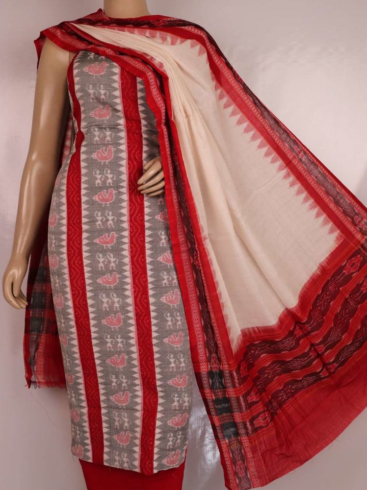 Close-up view of blouse piece with Sambalpuri motifs in grey and red cotton