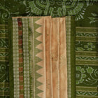 Extreme close-up of cream Sambalpuri silk saree showing exquisite handloom weave texture.