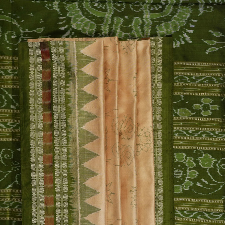 Extreme close-up of cream Sambalpuri silk saree showing exquisite handloom weave texture.