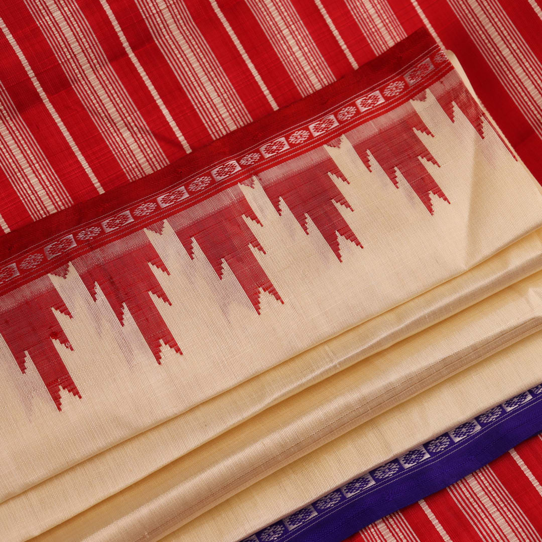 Close-up view of the intricate silk texture on a Berhampuri saree in white with a red border