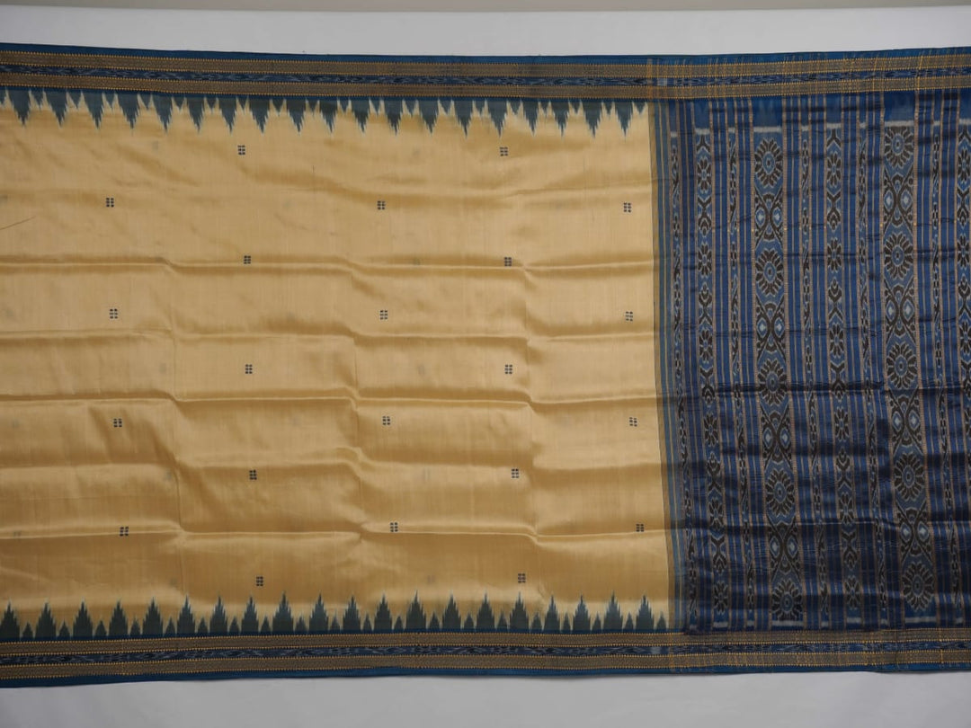 Elegant styling of cream and blue Khandua silk saree with butta pattern on model for traditional look