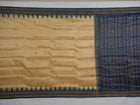 Elegant styling of cream and blue Khandua silk saree with butta pattern on model for traditional look