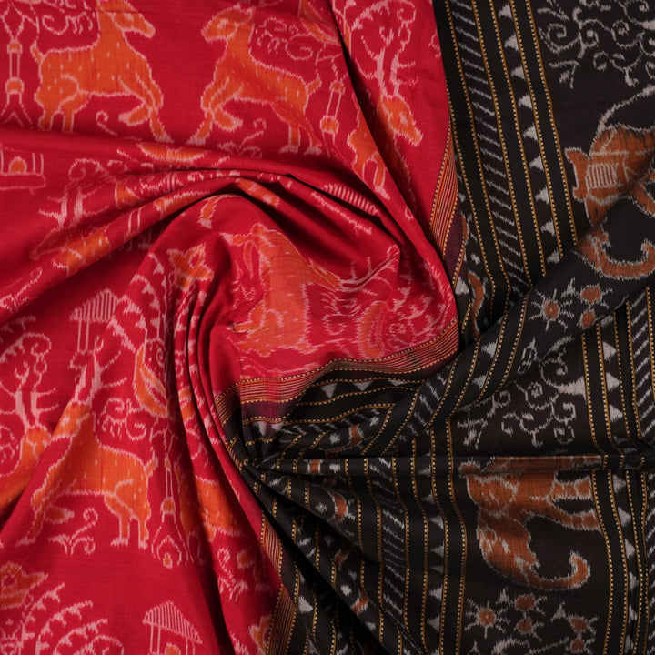 Flat layout view of the red and black Sambalpuri cotton saree showing the body, border, and pallu.