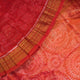 Close-up of rust Sambalpuri silk fabric, revealing its luxurious texture and fine handloom weave.