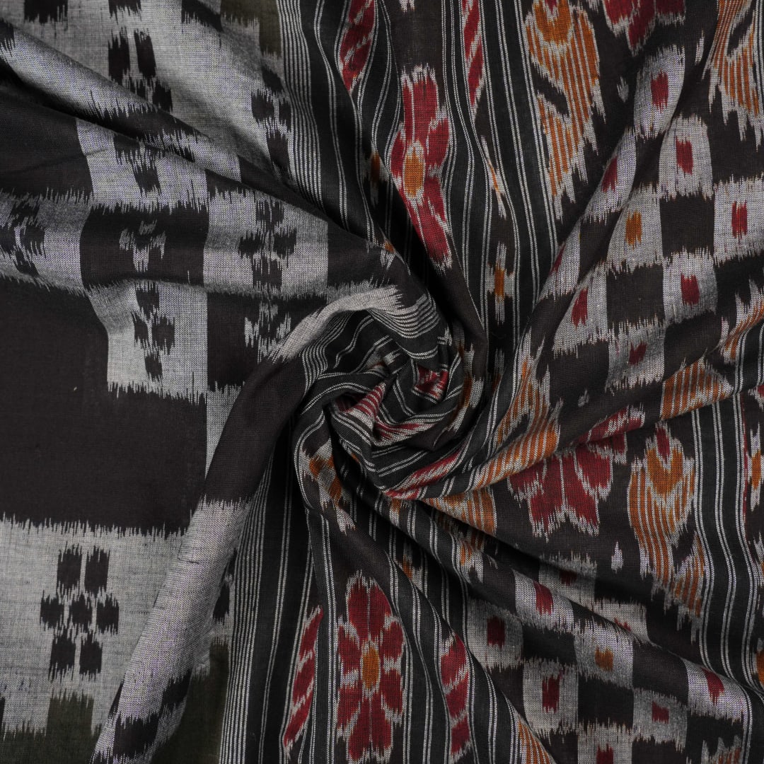 Model wearing a stylish green and black Sambalpuri cotton saree with traditional handloom woven motifs