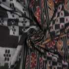 Model wearing a stylish green and black Sambalpuri cotton saree with traditional handloom woven motifs