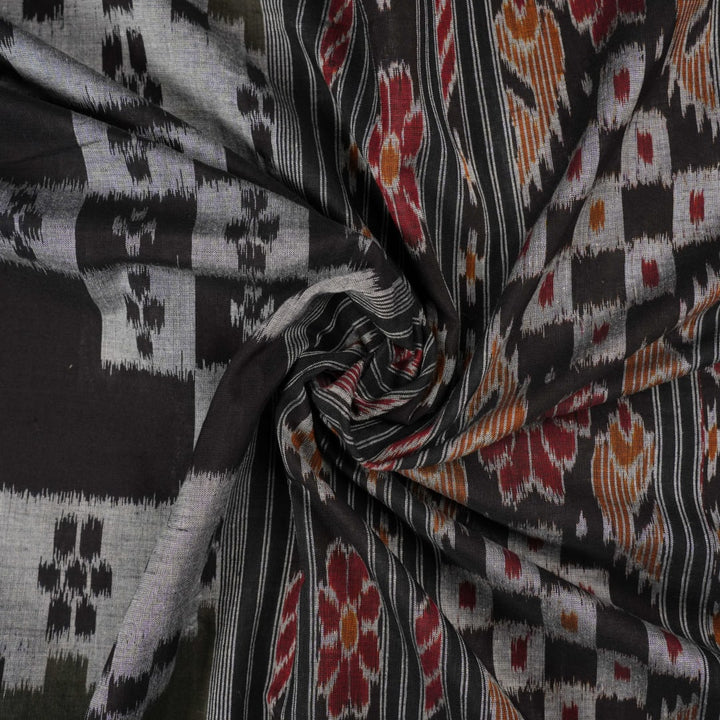 Model wearing a stylish green and black Sambalpuri cotton saree with traditional handloom woven motifs