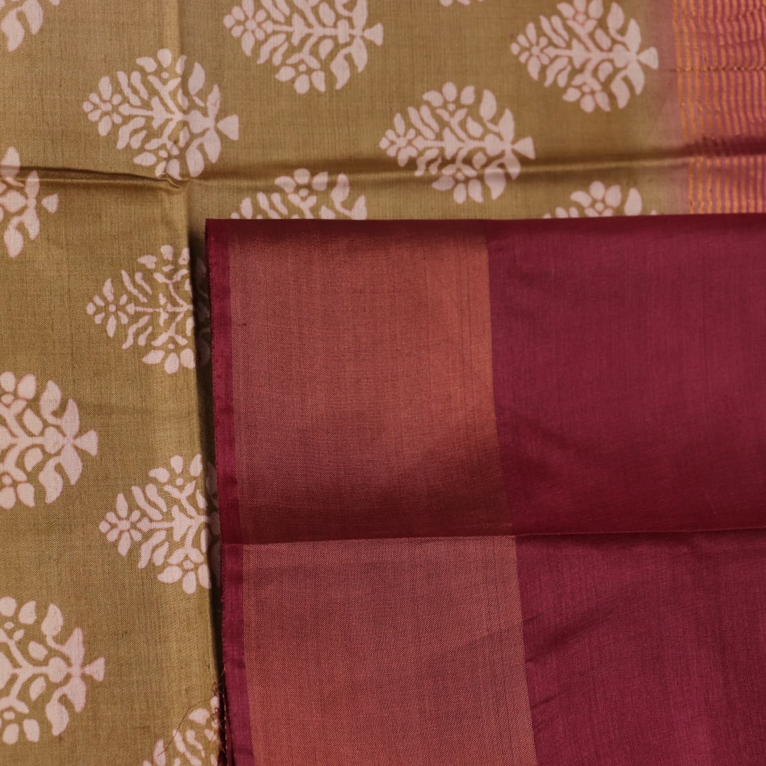Close-up of the distinctive slub texture of a multi-color printed Tussar Silk saree.