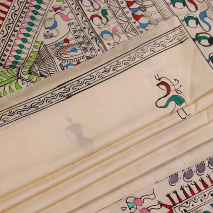 Close-up of the white silk saree fabric texture, showcasing the handloom weave and painted Patachitra details.