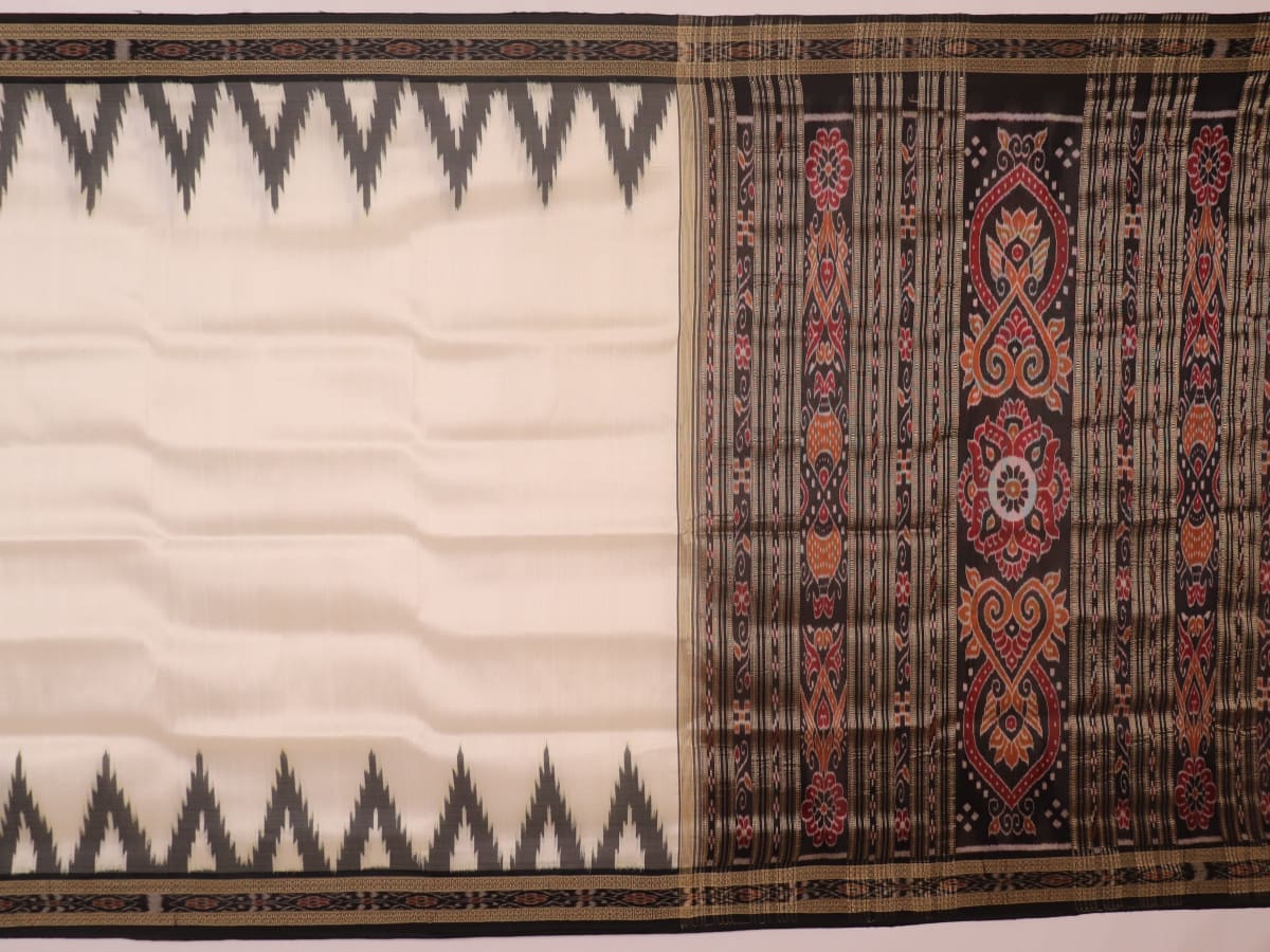 White Khandua silk saree draped, showcasing its plain body and simple elegance.