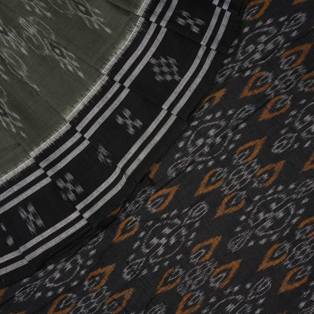 Elegant model drape of the grey and black Sambalpuri cotton saree showcasing traditional handloom motifs.