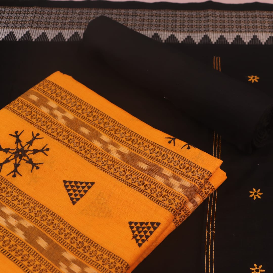 Close-up of yellow and black Sambalpuri cotton dress material blouse piece with motifs.