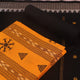 Close-up of yellow and black Sambalpuri cotton dress material blouse piece with motifs.