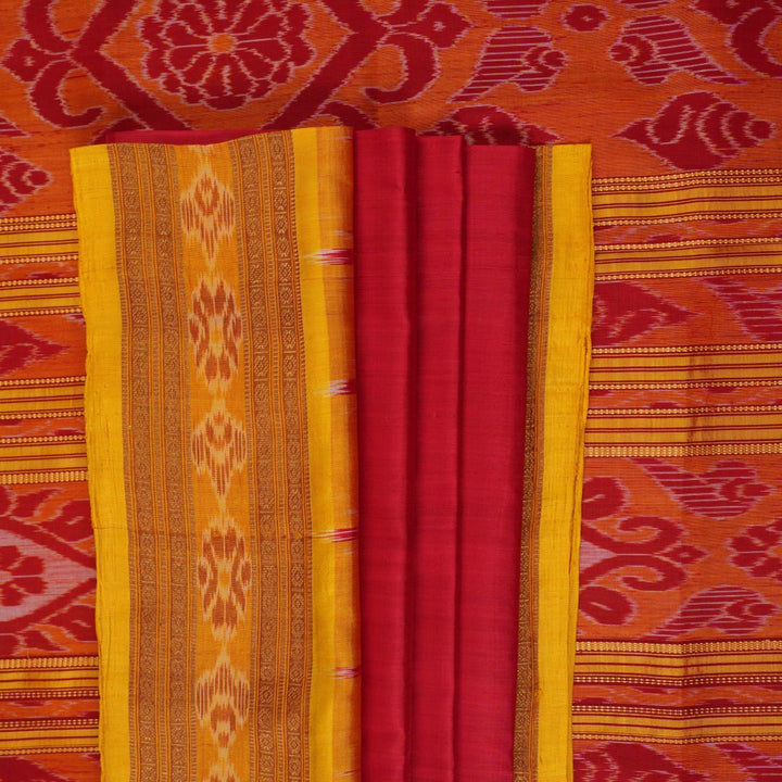 Model draped in a red and yellow Khandua silk saree with butta patterns for a traditional look.
