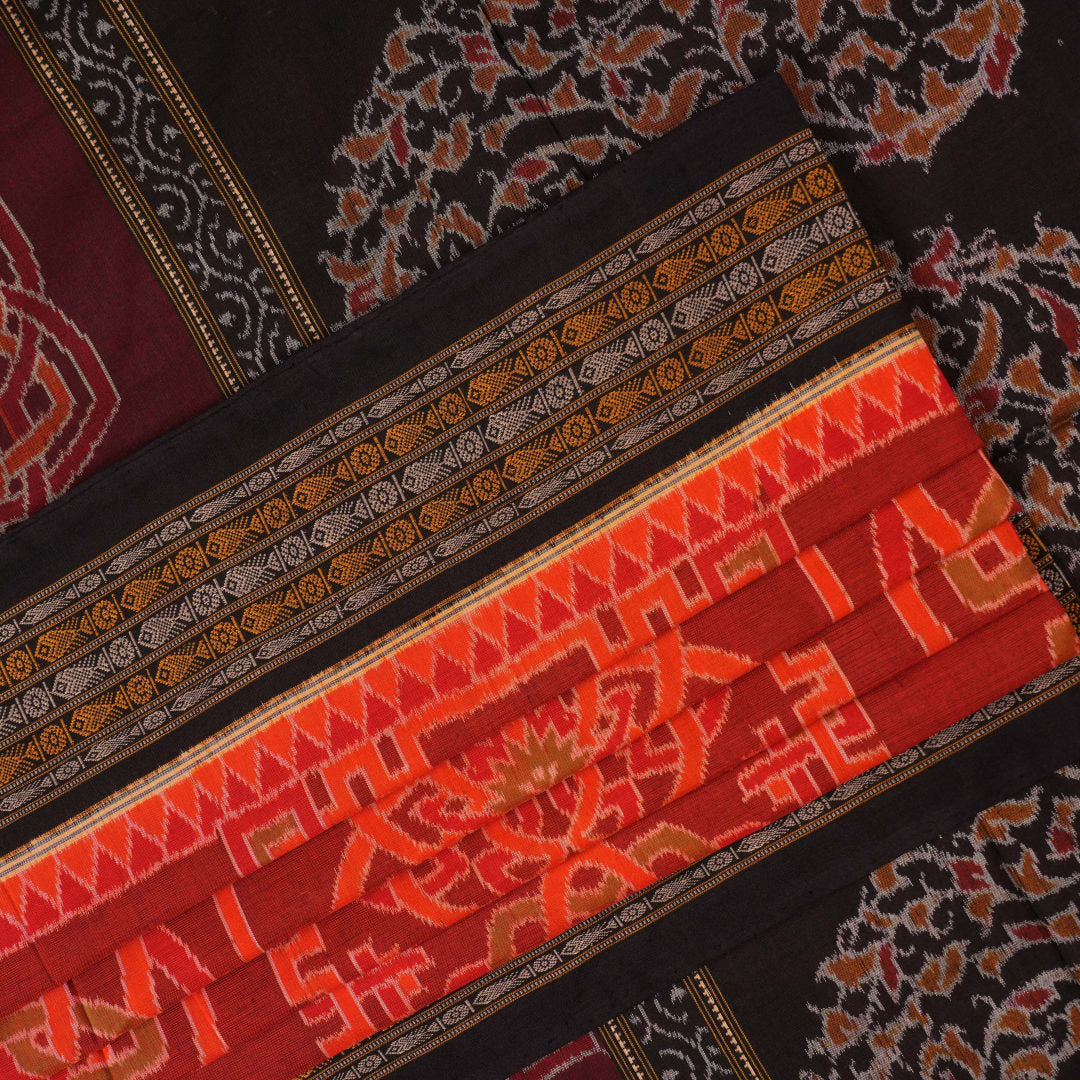 Full flat layout of the orange and black Sambalpuri cotton saree showing the body, border, and pallu