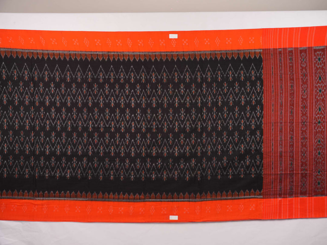 Elegant model styling of a black and orange Sambalpuri cotton saree showcasing the complete handloom look.