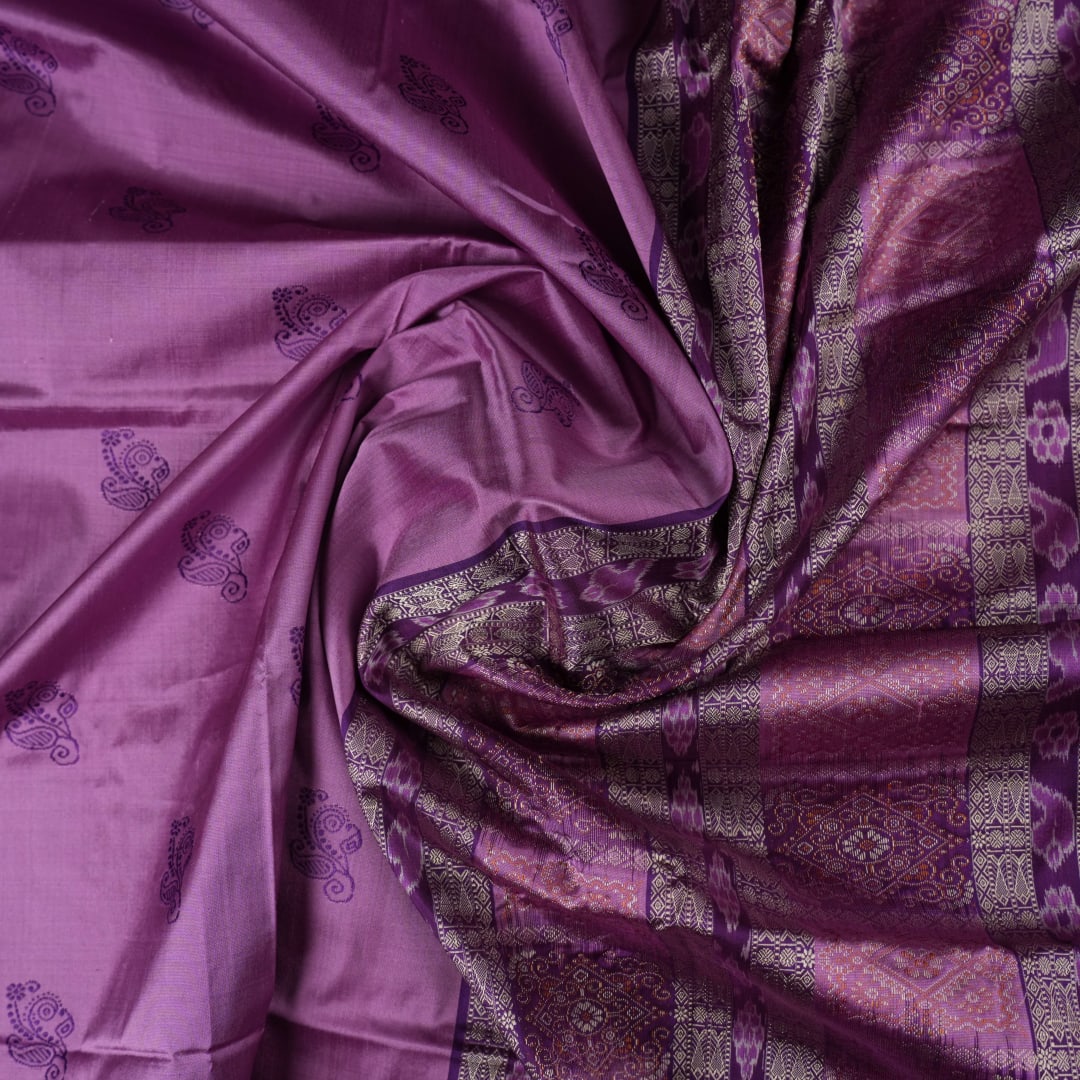 Close-up of purple Bomkai Silk Saree fabric, revealing its luxurious silk texture and exquisite handloom weave.