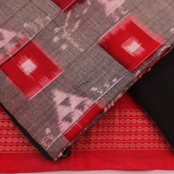 Detail of the grey and black Sambalpuri cotton dress material's blouse piece with motifs.