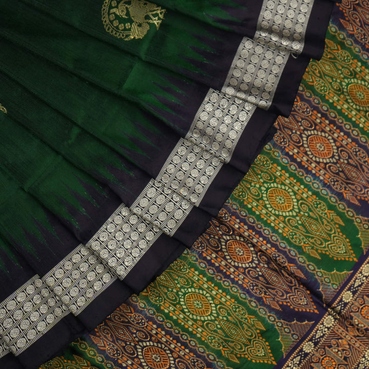 Close-up of Bomkai silk saree fabric, revealing rich texture and intricate handloom weave details.