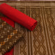 Green Sambalpuri cotton dress material blouse piece with red motifs.