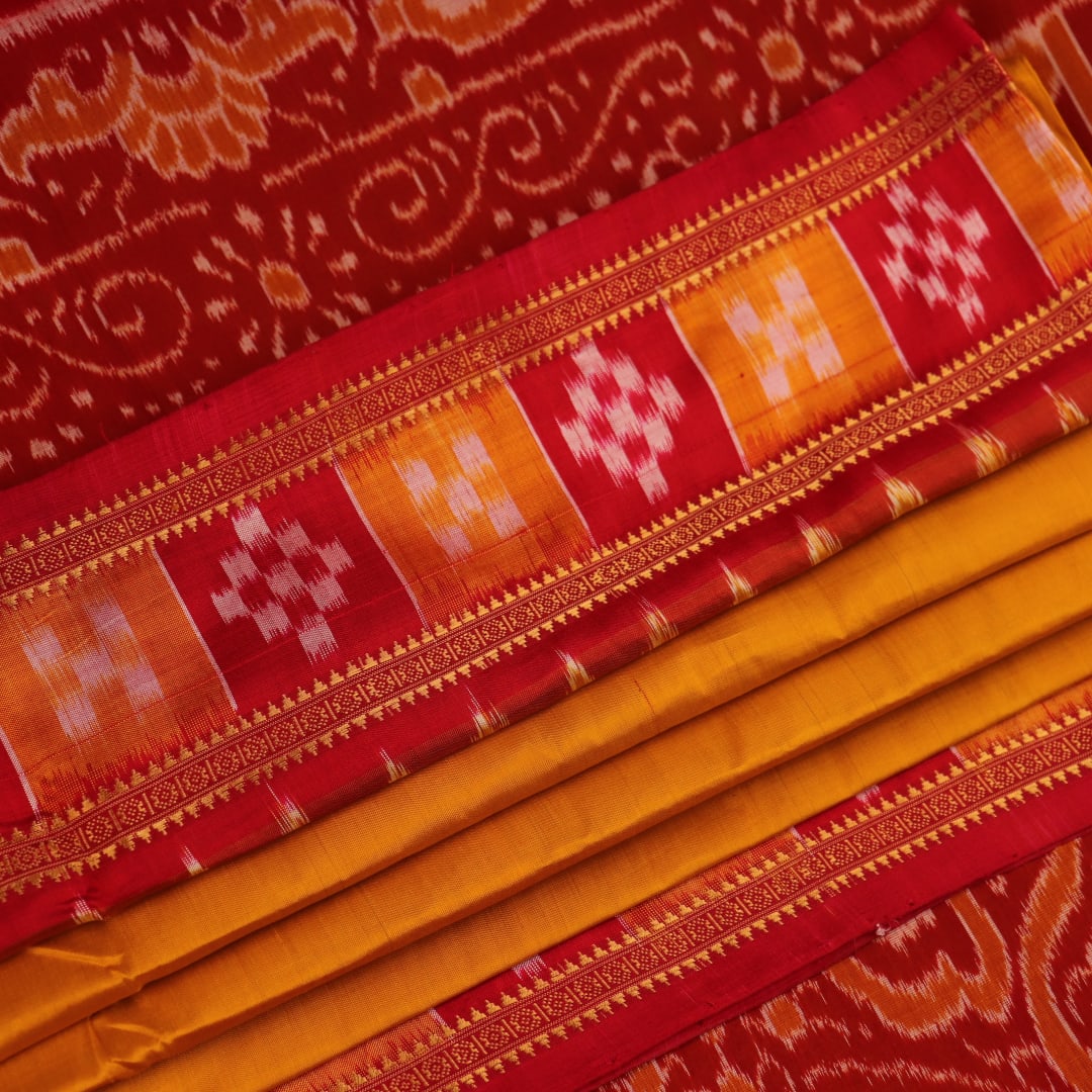 Styled drape view of yellow silk Khandua saree with red butta embroidery