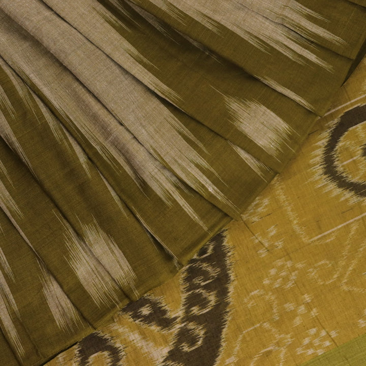 Plain green Sambalpuri cotton saree, showcasing elegant drape.