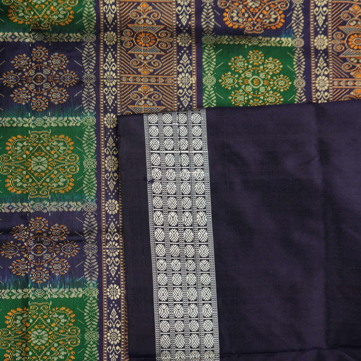 Close-up of Bomkai silk saree fabric, revealing rich texture and intricate handloom weave details.