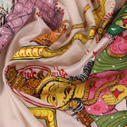 Close-up of handloom white silk Patachitra saree fabric showing texture and hand-painted details.