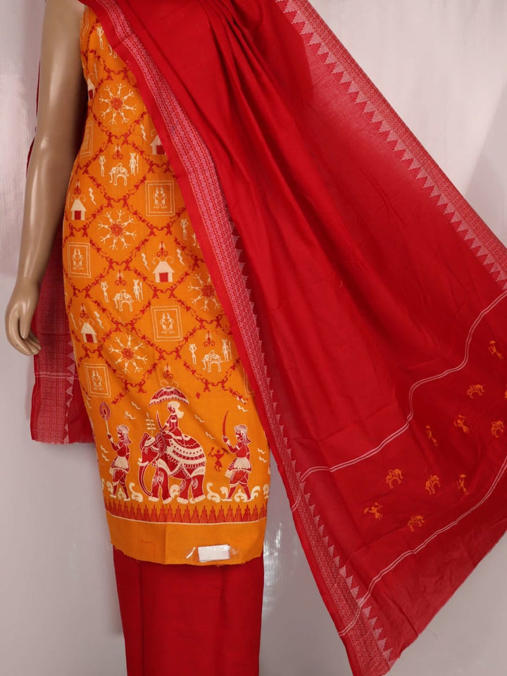 Close-up of Sambalpuri dress material blouse piece in yellow base with red doll motifs