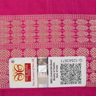 Close-up of the Bomkai Silk Saree's yellow fabric, revealing its luxurious texture and handloom weave.