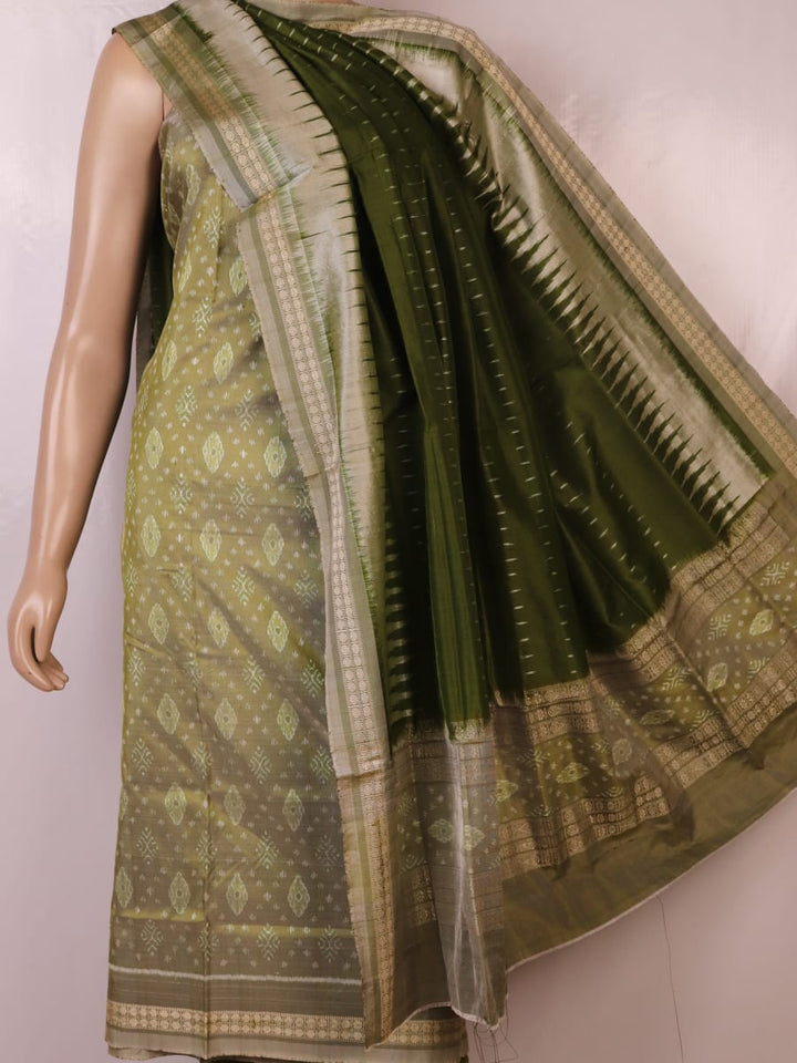 Detail of green Bomkai silk dress material's blouse piece with intricate motifs.