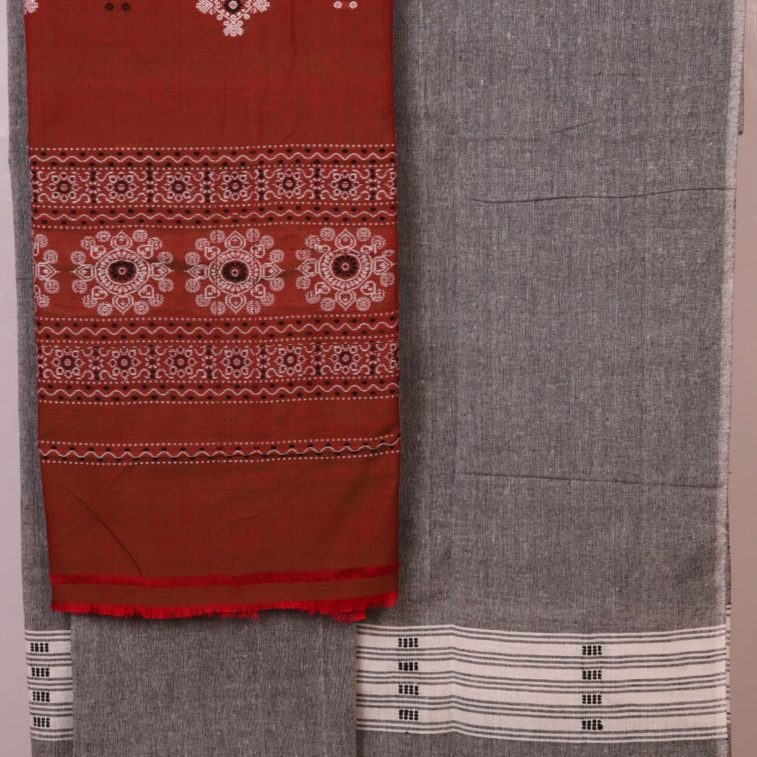 Coordinating Bomkai Cotton blouse piece detail, showcasing subtle multi-color patterns on a grey fabric.