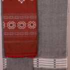 Coordinating Bomkai Cotton blouse piece detail, showcasing subtle multi-color patterns on a grey fabric.