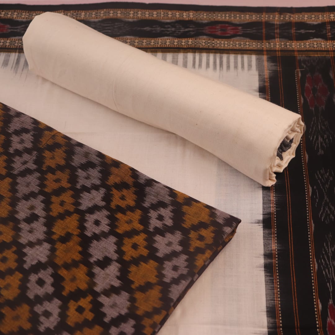 Detail of brown and white Sambalpuri cotton dress material blouse piece with motifs.