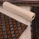 Detail of brown and white Sambalpuri cotton dress material blouse piece with motifs.