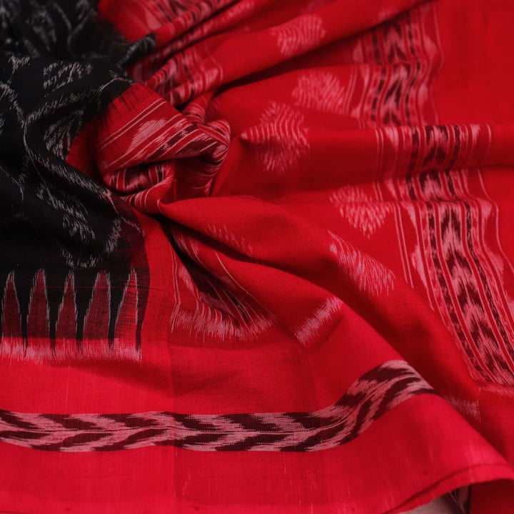 Stylishly draped Black Sambalpuri Dupatta in cotton with Red motifs