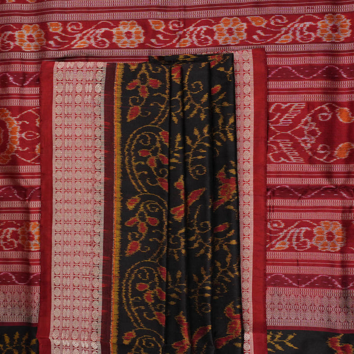 Close-up of Sambalpuri silk fabric texture, highlighting fine handloom weave in black and maroon.