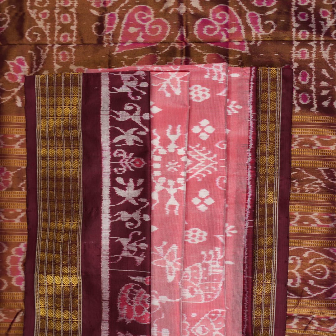 Close-up of luxurious silk fabric texture and intricate weave details of the multi-color Sambalpuri saree.