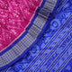 Close-up showing the luxurious handloom silk fabric texture and fine weave of the pink Sambalpuri saree.
