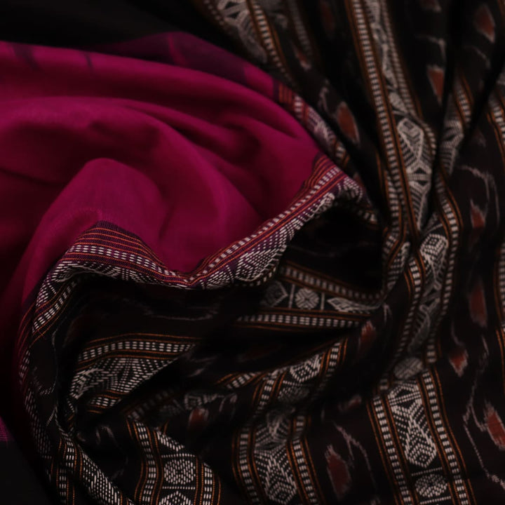 Full view of a magenta and black Bomkai cotton saree with intricate butta patterns.