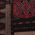 Styled view of a plain grey and black Sambalpuri cotton handloom saree.