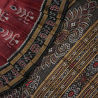 Full styling view of an elegant brown and black Khandua silk saree draped on a model for a classic look.