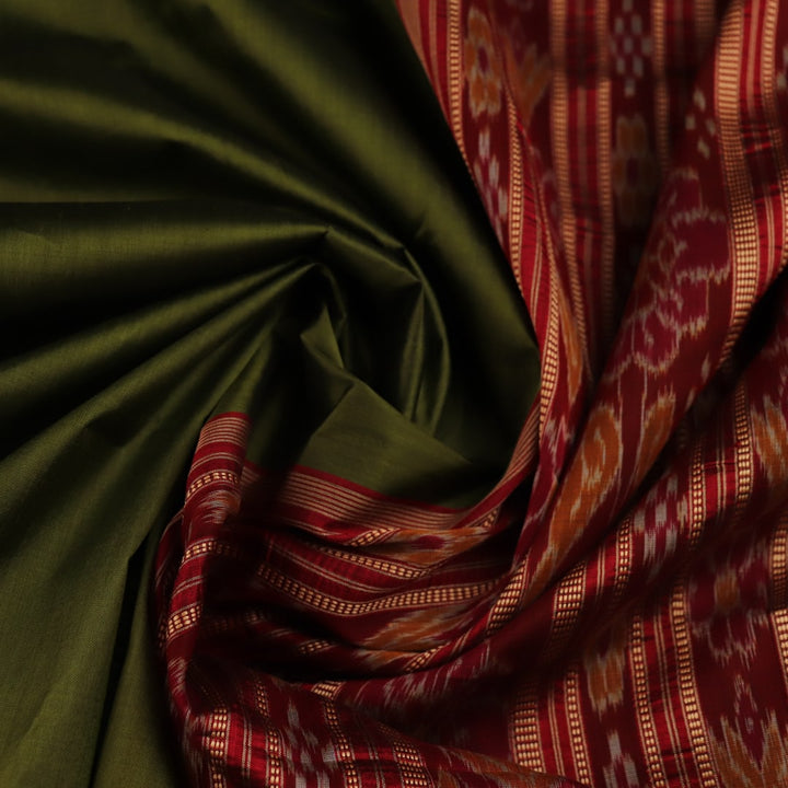 Styling view of vibrant green Khandua silk saree with maroon butta pattern